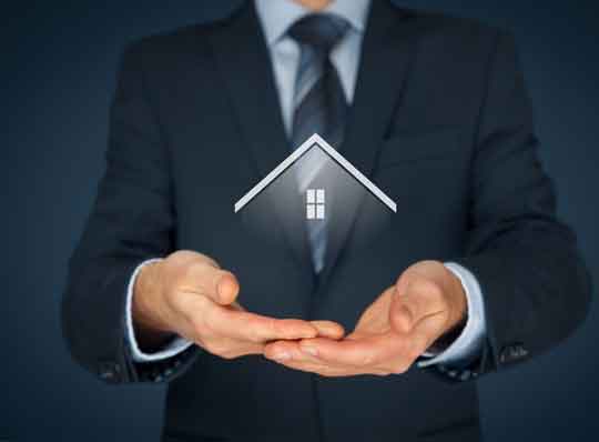 Graphic of man holding up a model of a house